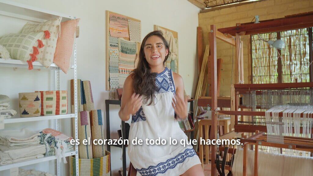 Zuahaza artisan in her workshop with loom and textiles.