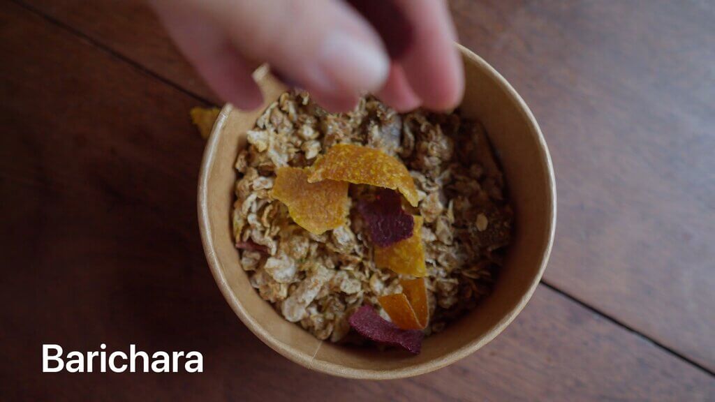 Bowl of granola with dried fruit, ready to eat at Casa Común. Text: Barichara