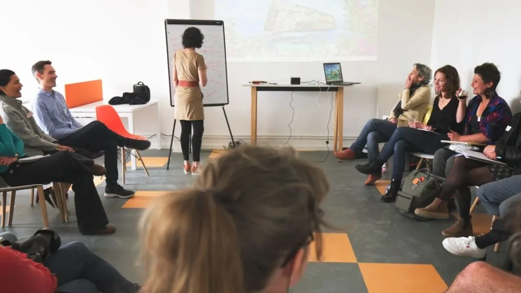 Presentation with a group of people in a meeting room.
